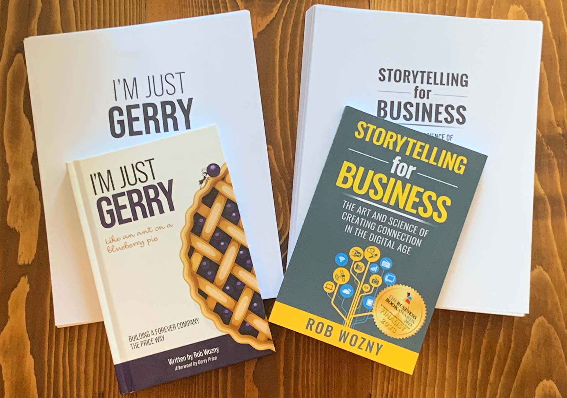 Book covers and manuscripts for I'm Just Gerry and Storytelling for Business